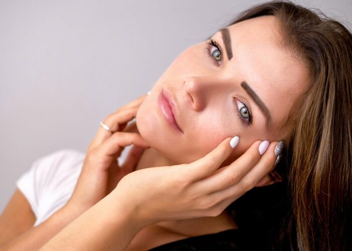 Beautiful woman with glowing skin after using Retinol